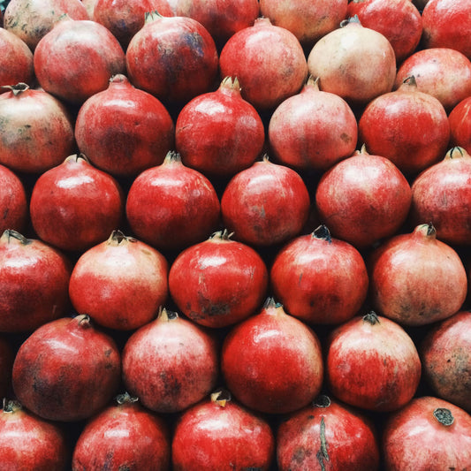 pomegranates arranged in a staggered grid