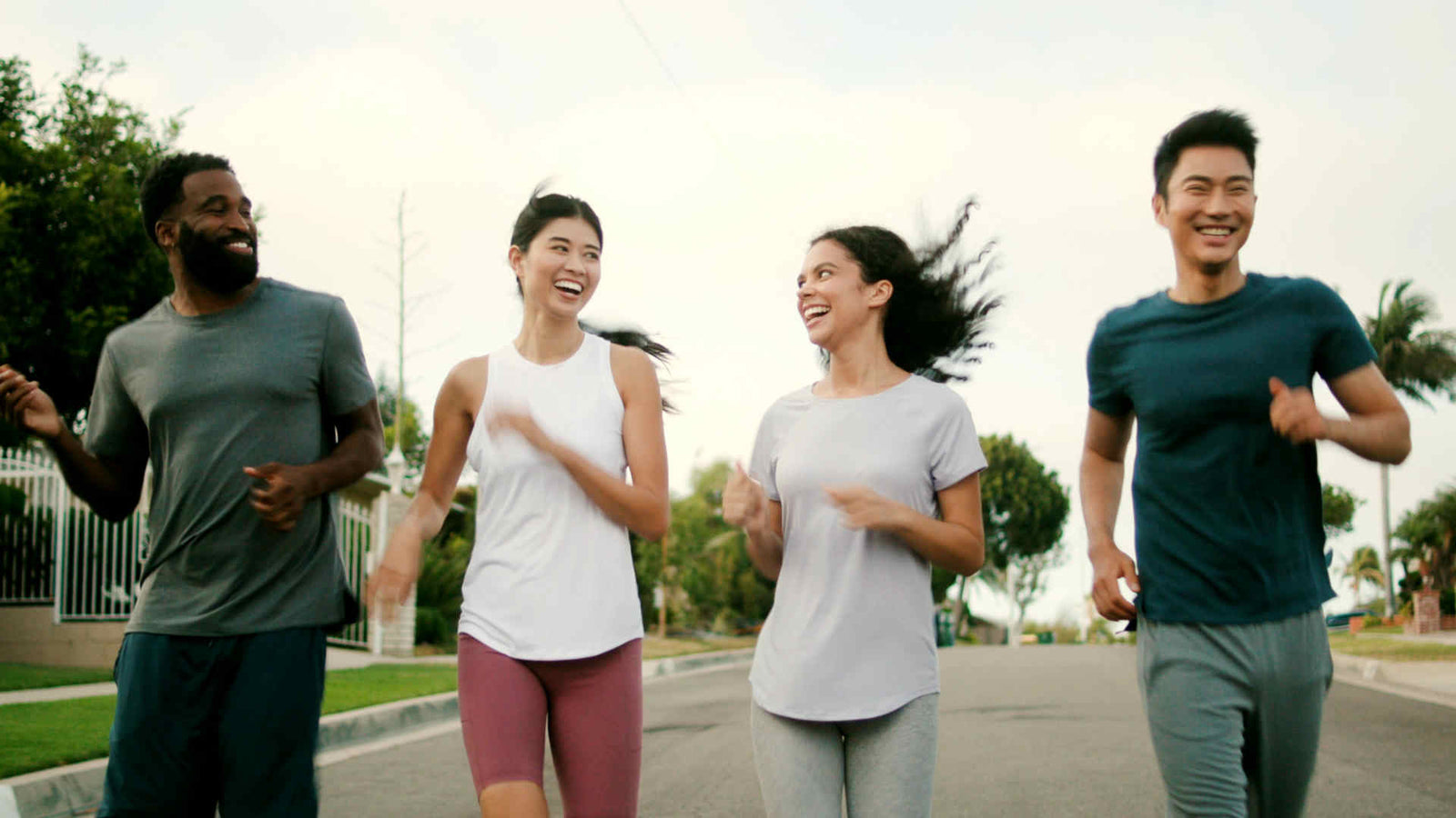 health is a daily routine. four people enjoying their daily routine of running